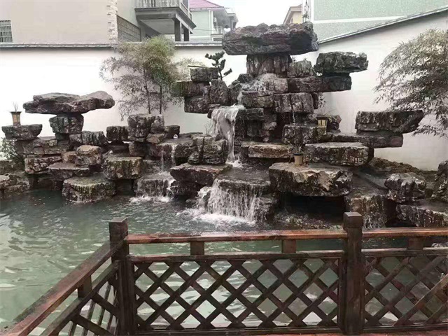 广东小庭院假山鱼池布置图